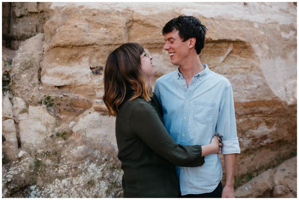 Couple with arms around each other